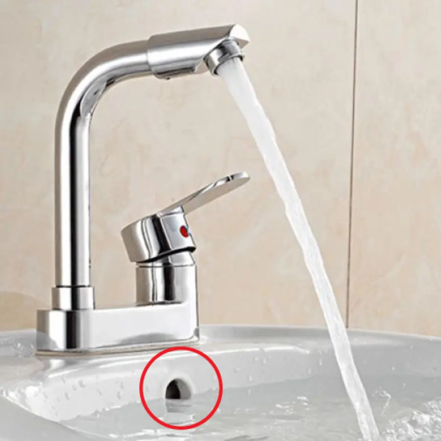 The wash basin usually has a small round hole, it is not used for decoration but what is it used for?